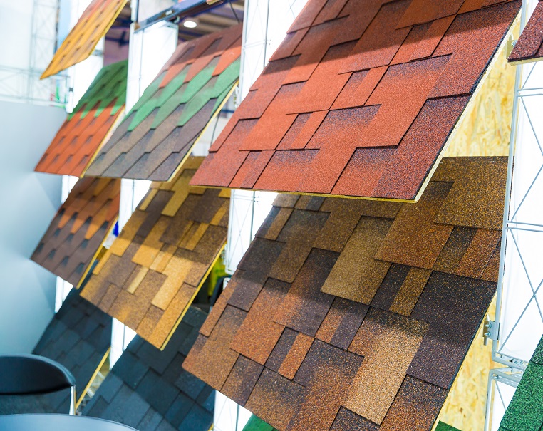 Bitumen tile, exhibition sample in the store. Colorful shingles in shop, building material, roofing